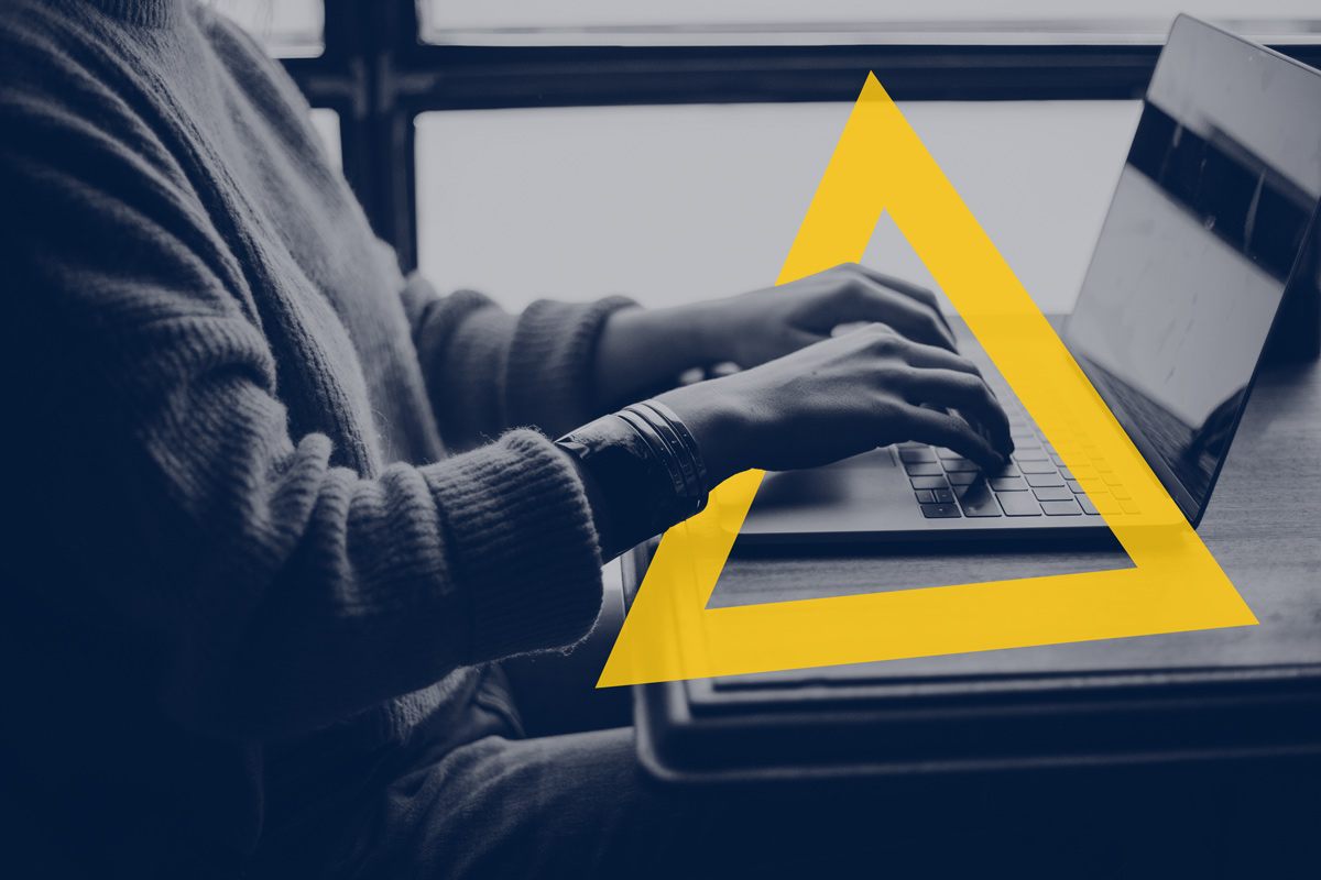 Laptop with yellow triangle